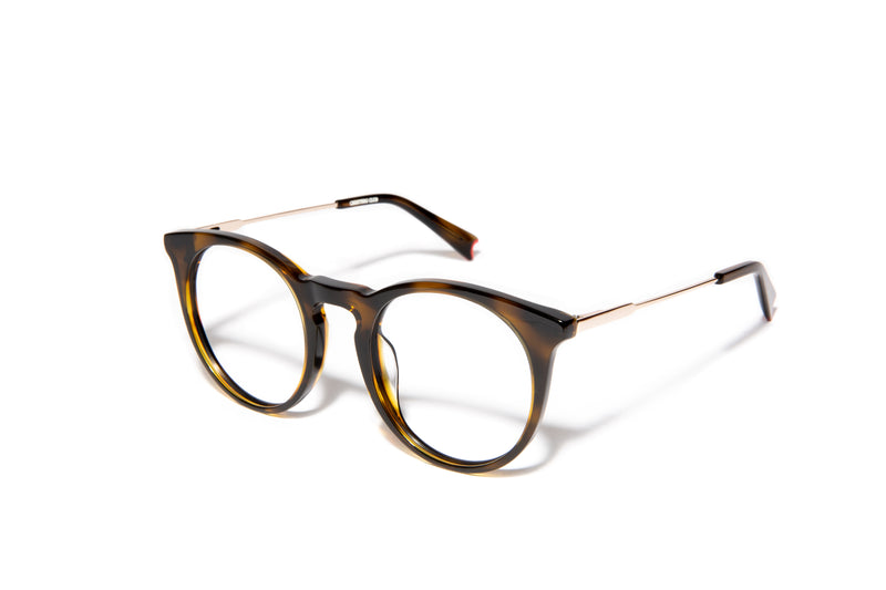 Image of Cheeterz Club eyewear. Photo of retro classic round eyeglasses with clear lenses and blue light blocking technology. The frames are medium width and light and dark brown color. Suitable for square, oval, and oblong face shapes. These glasses can be used as reading glasses with blue light glasses.
