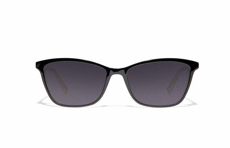 Image of Cheeterz Club eyewear. Photo of cat eye sunglasses with gray tinted lenses. The frames are medium width with a black color. Suitable for round, oval, and heart shaped face shapes. 