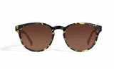 Image of Cheeterz Club eyewear. Photo of round sunglasses with brown tinted lenses. The frames are medium width with green and black camo print. Suitable for square, oval, and oblong shaped face shapes. 